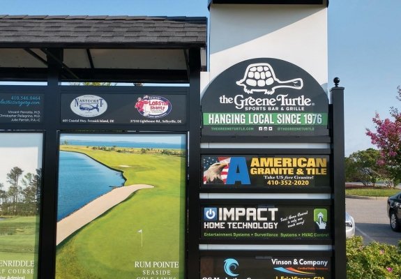 greene turtle ad on lighthouse sound golf course leader board 
